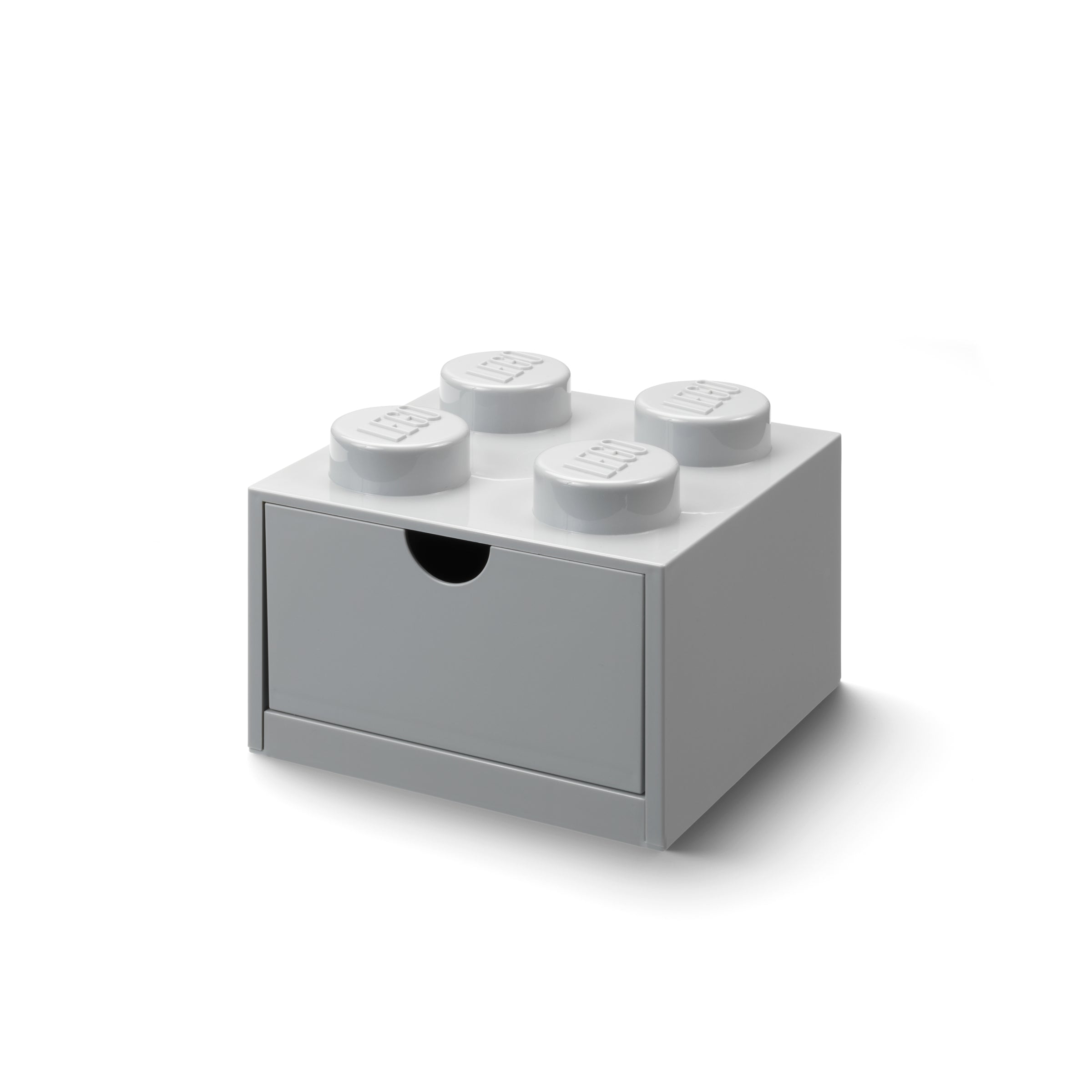 Szara szufladka na biurko LEGO w kształcie klocka z czterema wystającymi stemplami
