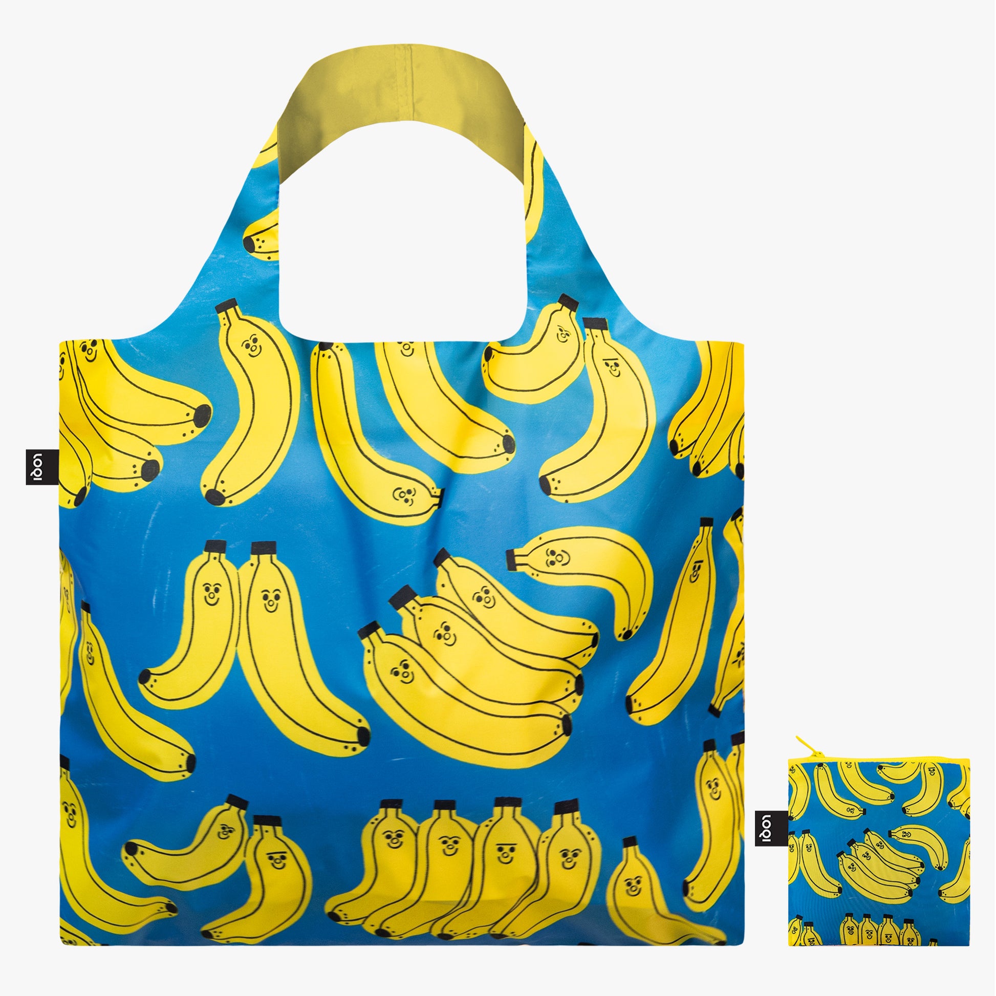 Torba podręczna z bananami na niebieskim tle z uśmiechniętymi żółtymi bananami od Yamann