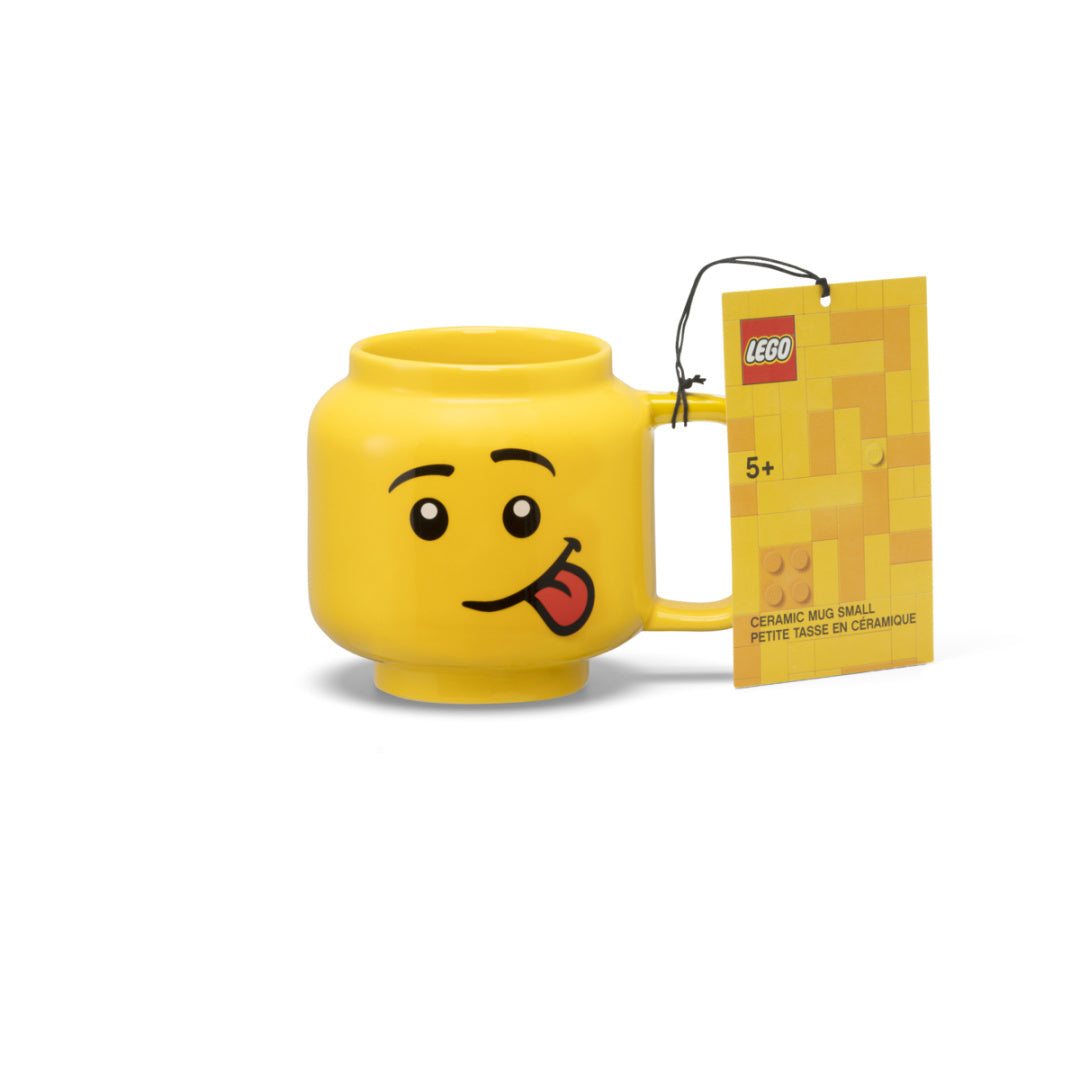 kubek LEGO głowa ceramiczny z żółtą uśmiechniętą twarzą i językiem wystającym z ust