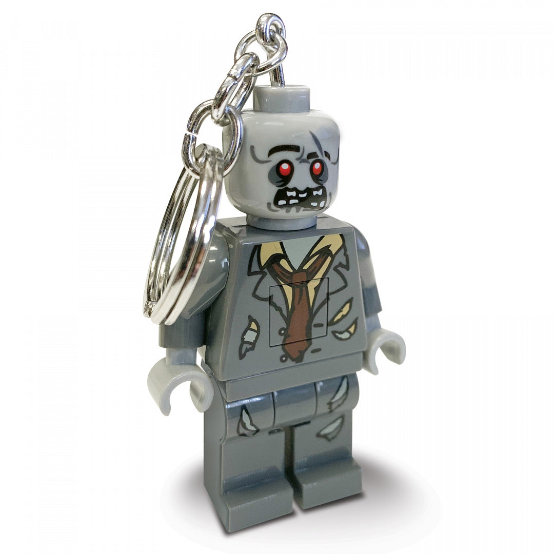 Szary brelok z latarką LEGO przedstawiający zombie z czerwoną świecącą latarką MOB