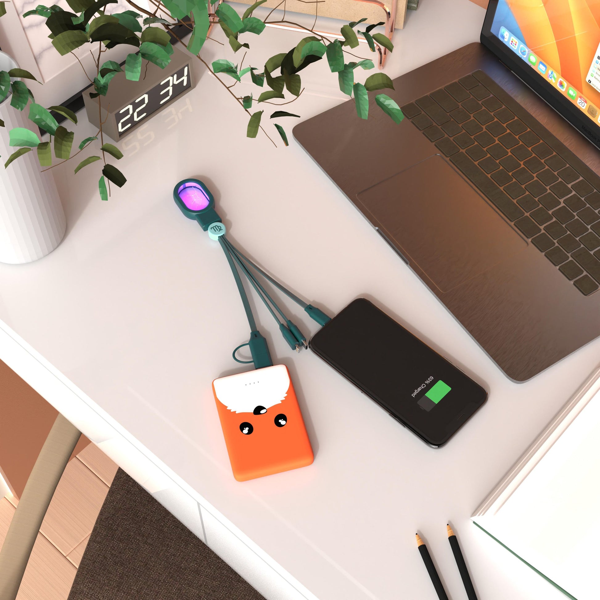 kabel 5 w 1 Bliźnięta ładowanie smartfona i powerbanku na biurku obok laptopa i rośliny