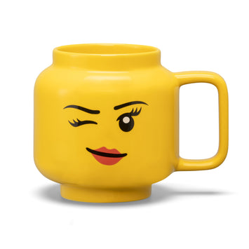 LEGO mug large head girl in yellow color with a smiling face and one eye closed