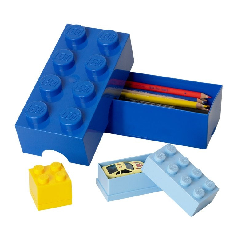 Lunchbox LEGO żółty oraz niebieskie i jasnoniebieskie pudełka na kredki i zabawki