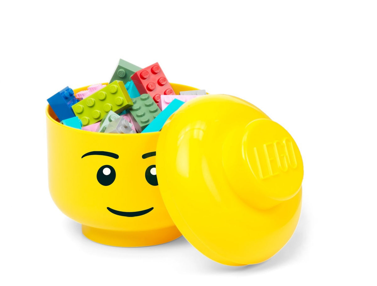 Pojemnik LEGO głowa dziewczynka w żółtym kolorze z uśmiechniętą twarzą i kolorowymi klockami w środku