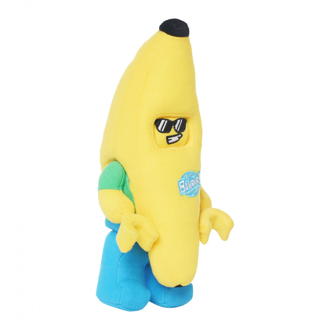 Pluszak LEGO banan w żółtym kostiumie z niebieskimi spodniami i zielonymi rękawami