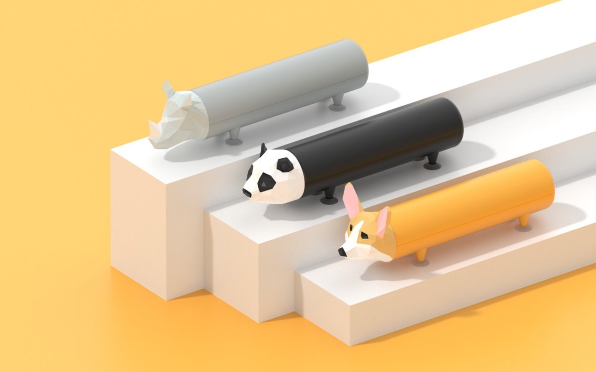 Powerbank piesek corgi w kolorze pomarańczowym obok szarych powerbanków w kształcie psa