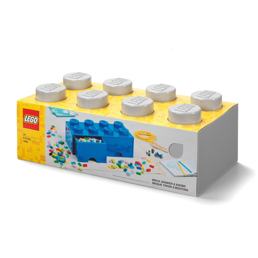 Niebieska szuflada LEGO dla dzieci w kształcie klocka z ośmioma szarymi pokrętłami do przechowywania
