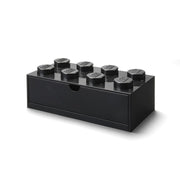 Czarna szufladka LEGO na biurko w kształcie klocka z ośmioma wystającymi wypustkami